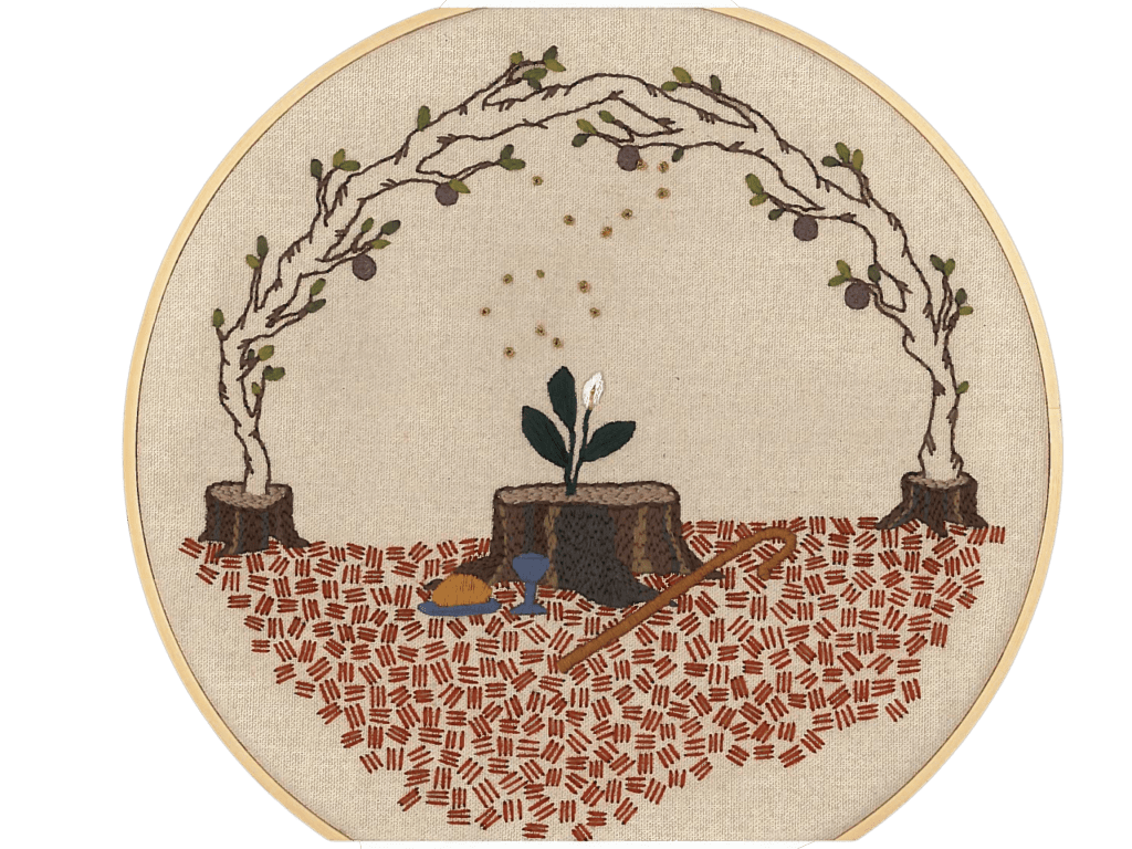 A piece of embroidery work on beige fabric, in a natural wooden embroidery hoop. Growing from a small stump on each side are fig tree branches that intertwine at the top. A larger stump in the middle has a sprout growing out of it. In front of the large stump on the ground are a Communion plate and chalice, and a shepherd's crook. 